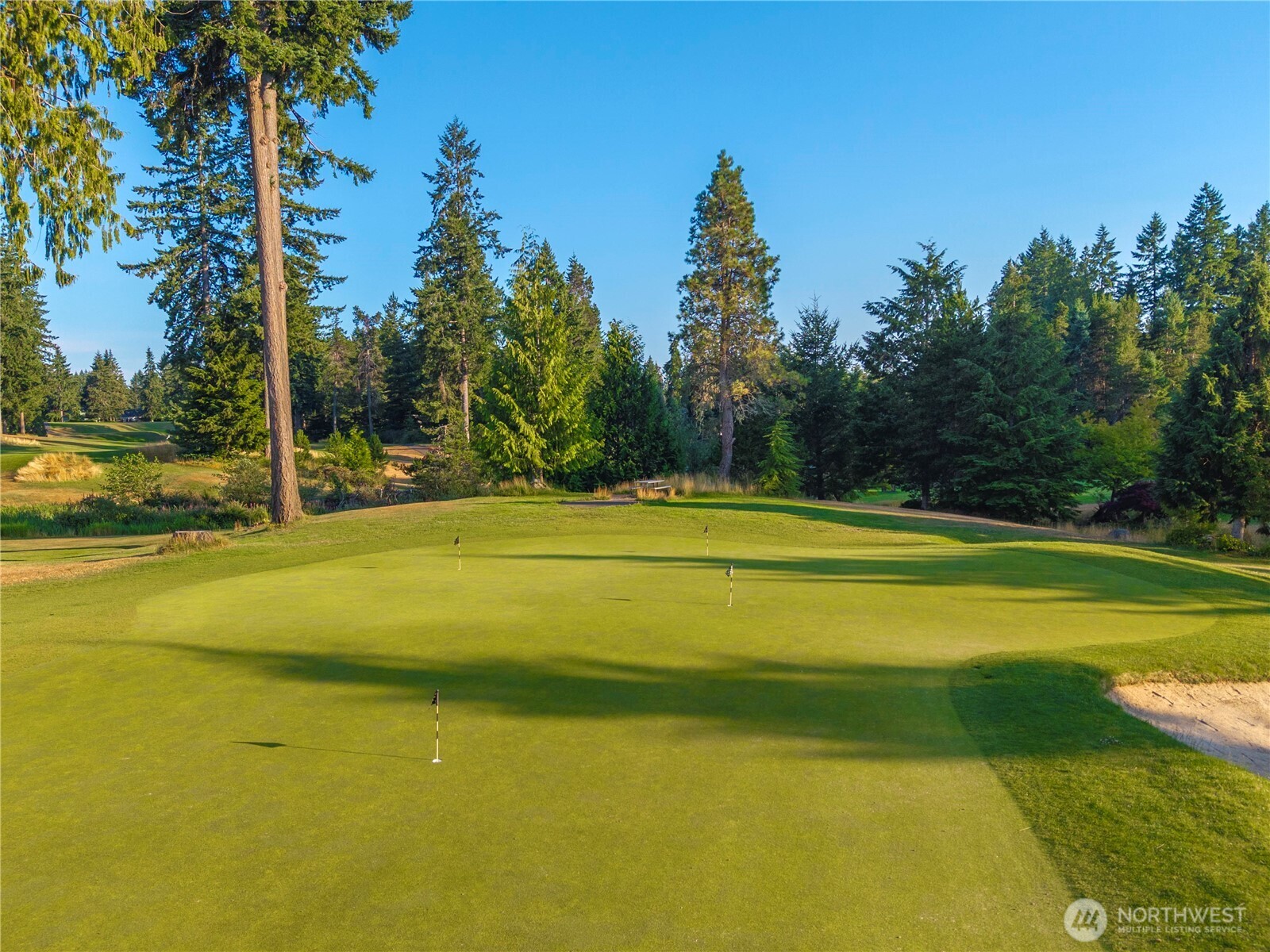 4083 Southwest Rustler Street Port Orchard, WA 98367 - Photo 25 of 32 a view of a swimming pool with an outdoor space and seating area