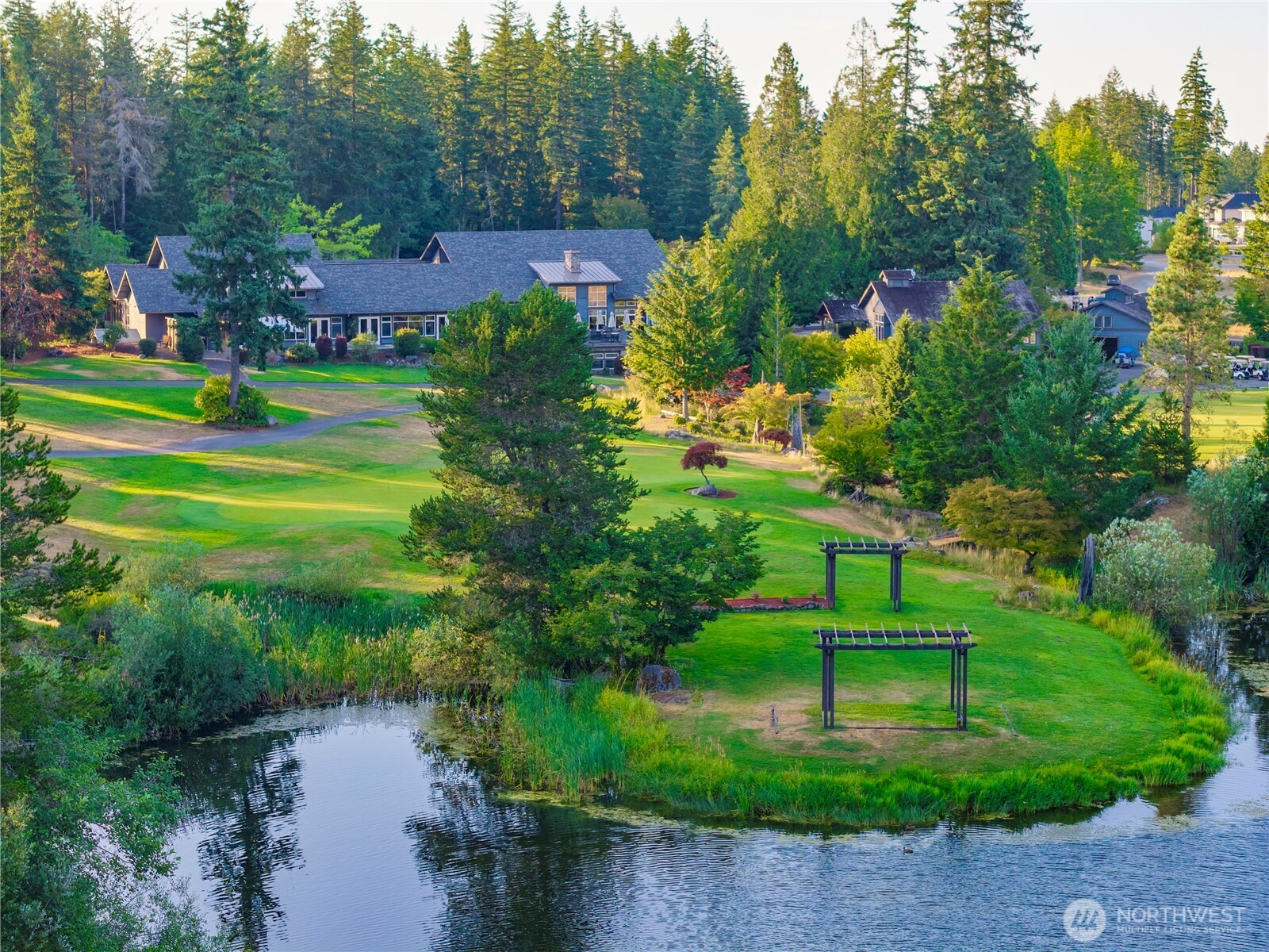 4083 Southwest Rustler Street Port Orchard, WA 98367 - Photo 27 of 32 a view of a park with large trees and a park