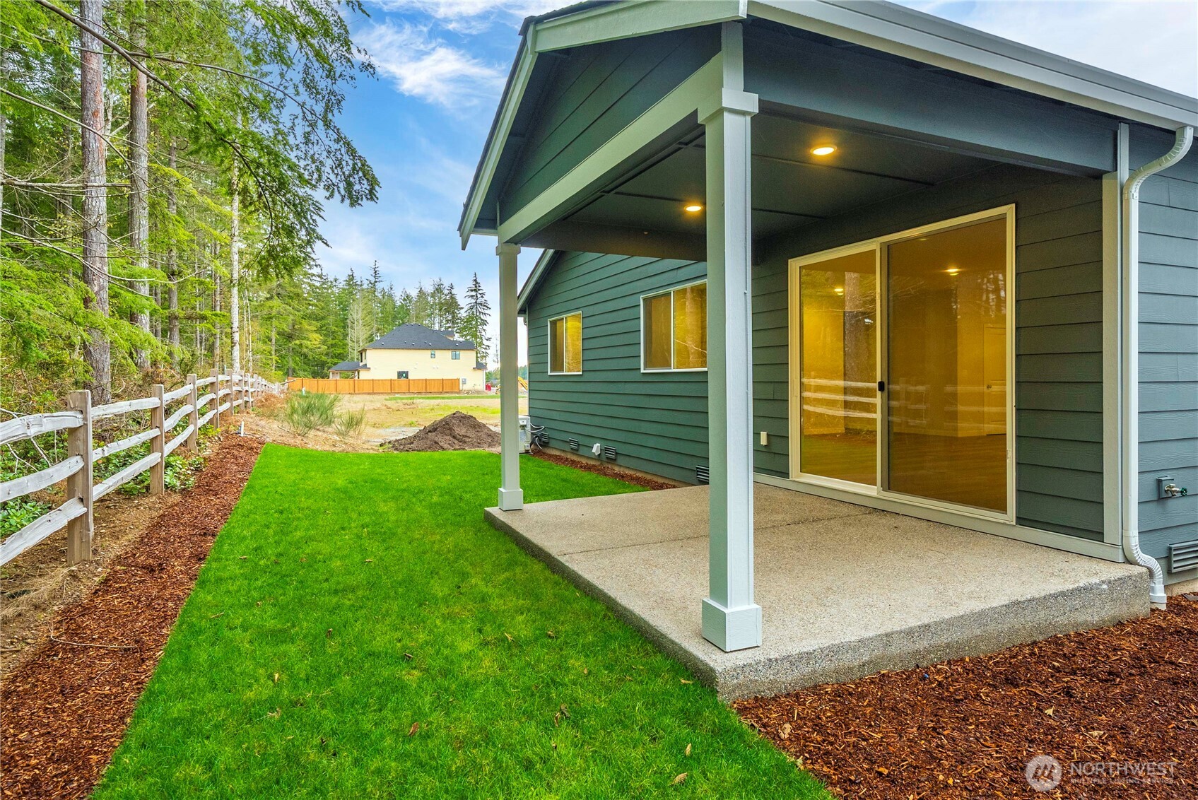 4083 Southwest Rustler Street Port Orchard, WA 98367 - Photo 30 of 32 a view of a backyard with a garden