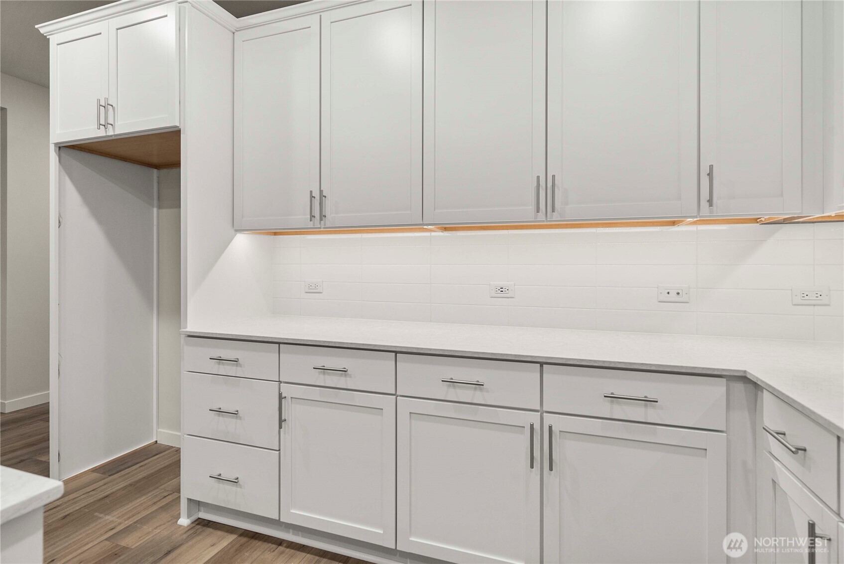 4083 Southwest Rustler Street Port Orchard, WA 98367 - Photo 8 of 32 a view of cabinets with wooden floor