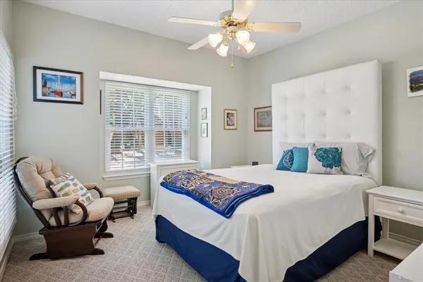 a bedroom with a bed and a couch