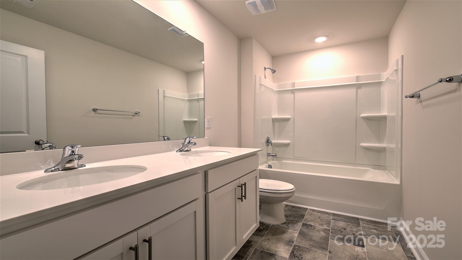 109 Salers Road Fletcher, NC 28732 - Photo 17 of 27 a bathroom with a sink a toilet and shower