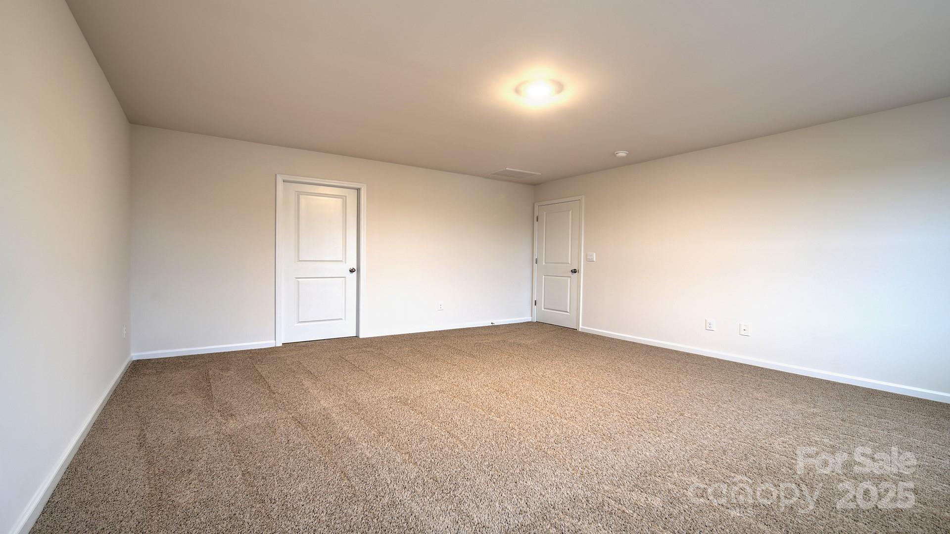 109 Salers Road Fletcher, NC 28732 - Photo 21 of 27 an empty room with white cabinet and windows