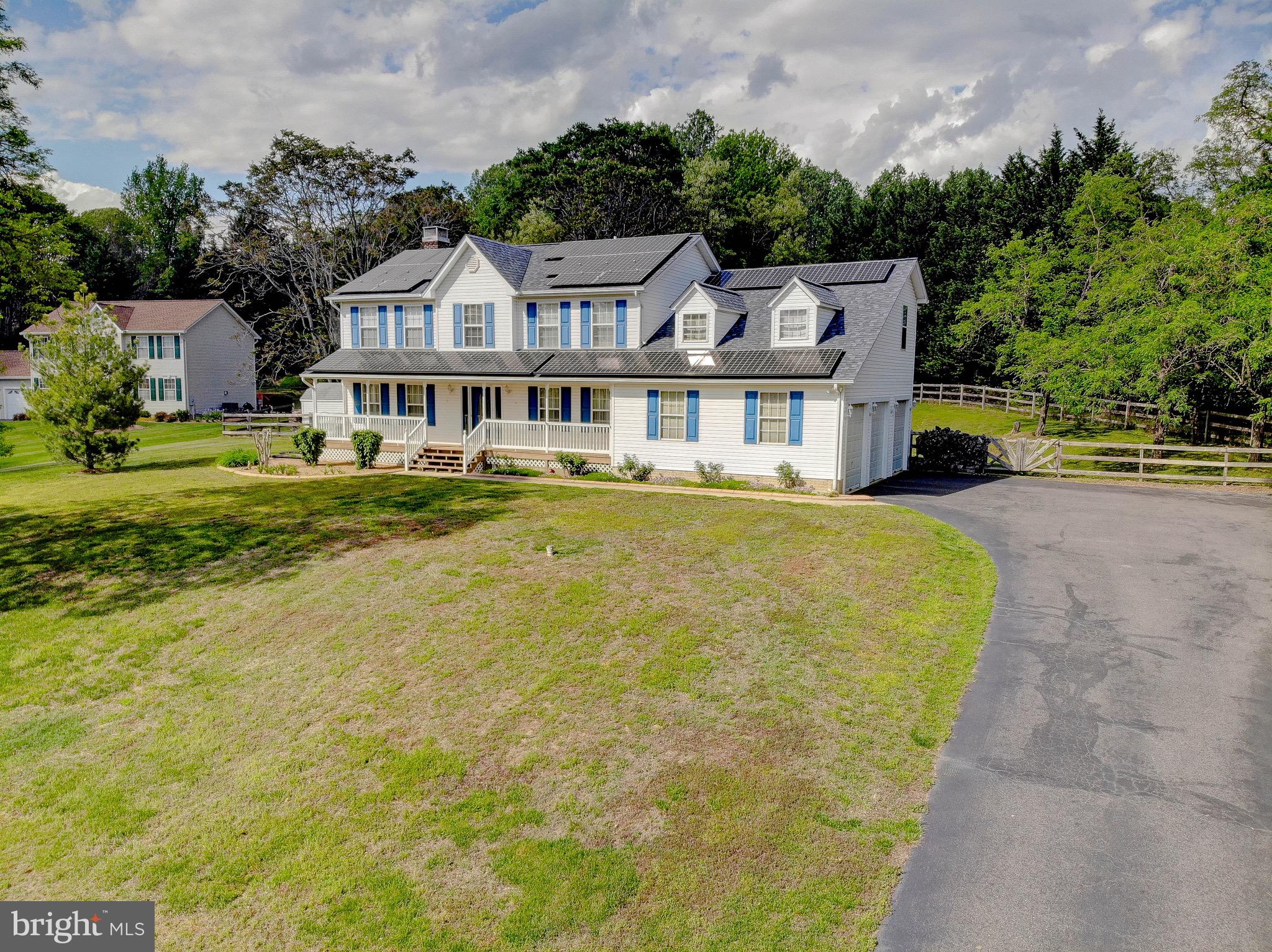 3305 Smithville Drive Dunkirk, MD 20754 - Photo 102 of 109 a view of a white house with a big yard and potted plants