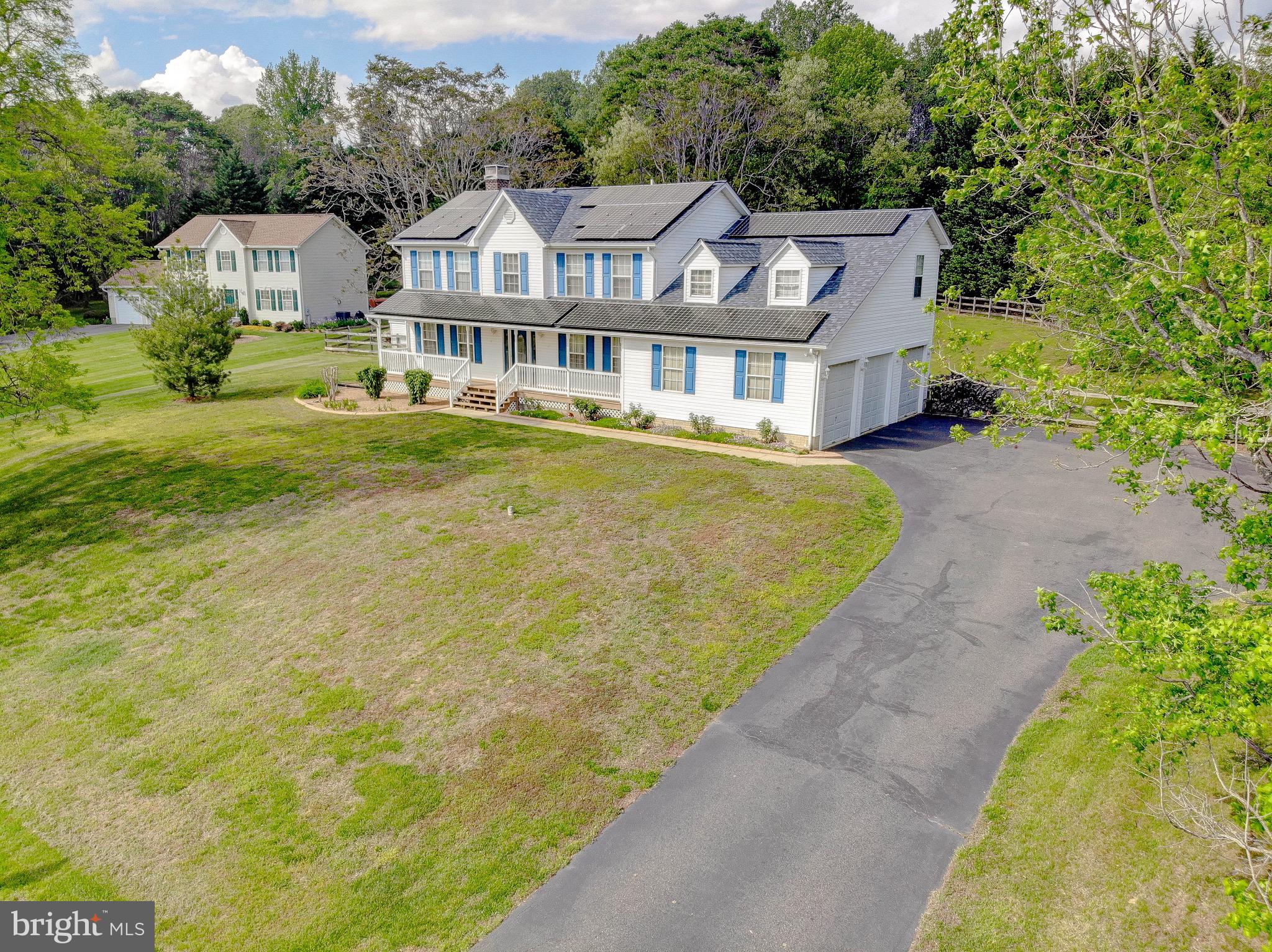 3305 Smithville Drive Dunkirk, MD 20754 - Photo 105 of 109 a front view of a house with a garden