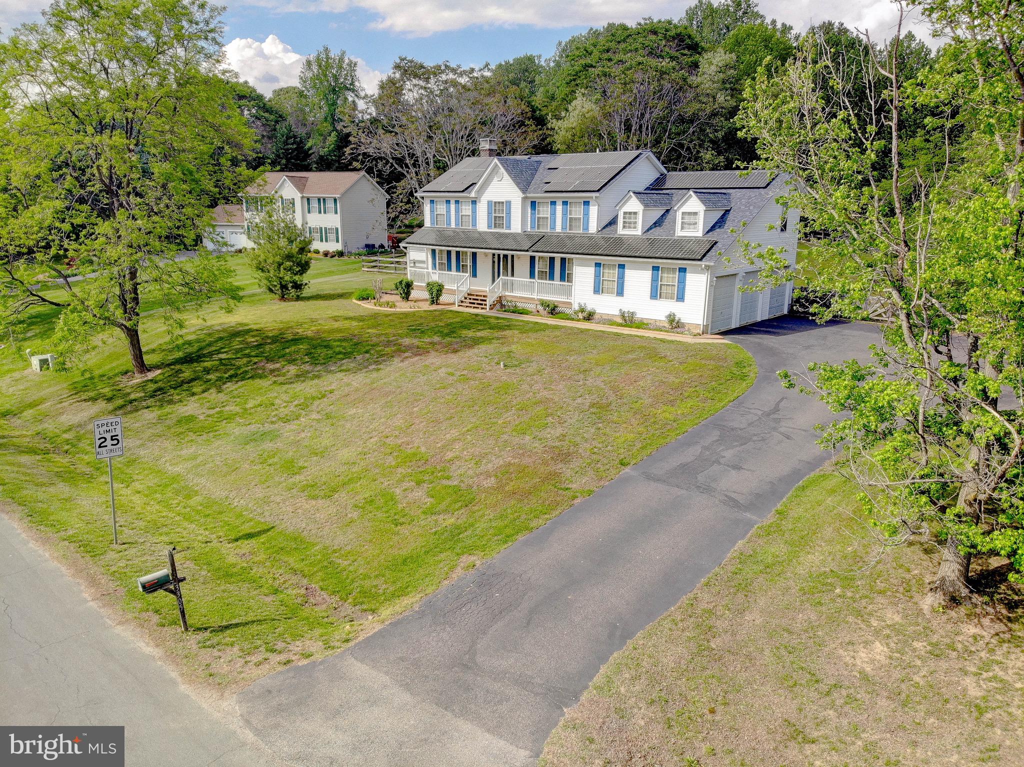 3305 Smithville Drive Dunkirk, MD 20754 - Photo 106 of 109 a front view of a house with a yard and trees