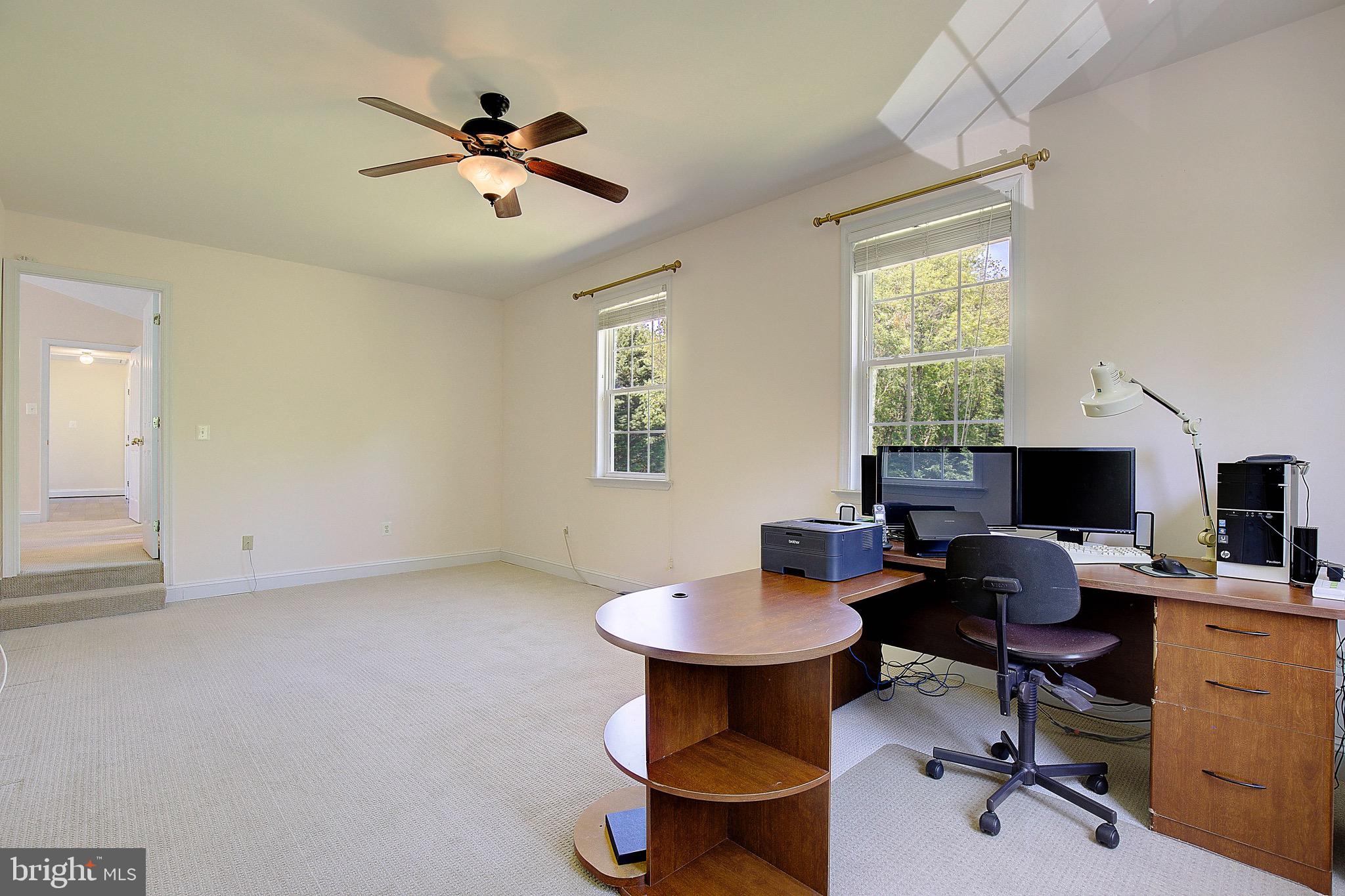 3305 Smithville Drive Dunkirk, MD 20754 - Photo 41 of 109 a work room with furniture a rug potted plant and a window