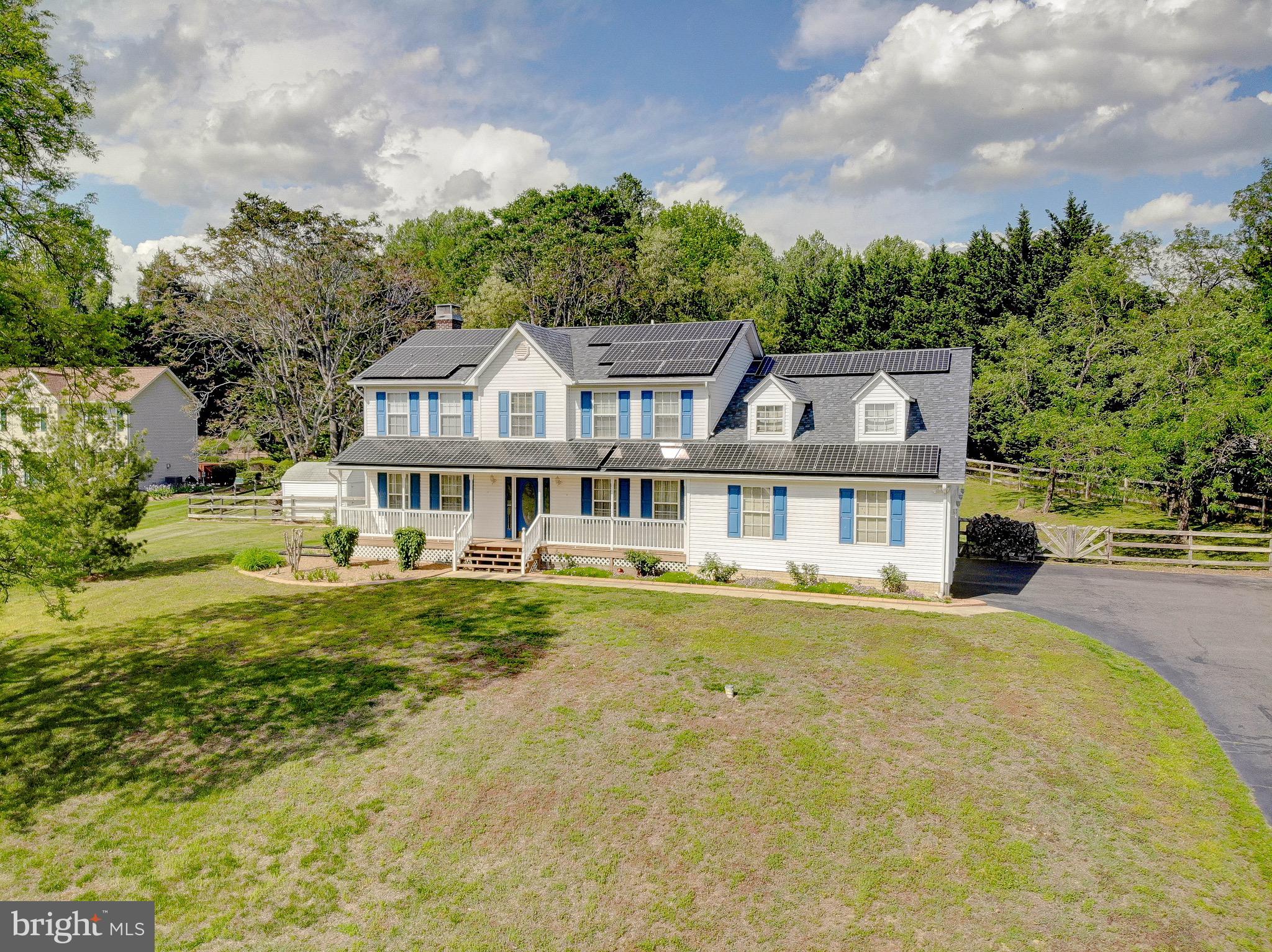 3305 Smithville Drive Dunkirk, MD 20754 - Photo 77 of 109 a front view of a house with a garden and trees