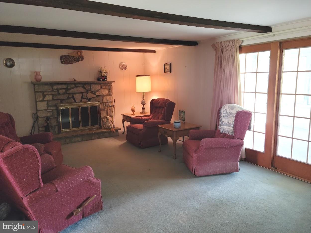 25 Brookline Road Warminster, PA 18974 - Photo 4 of 31 a living room with furniture and a fireplace