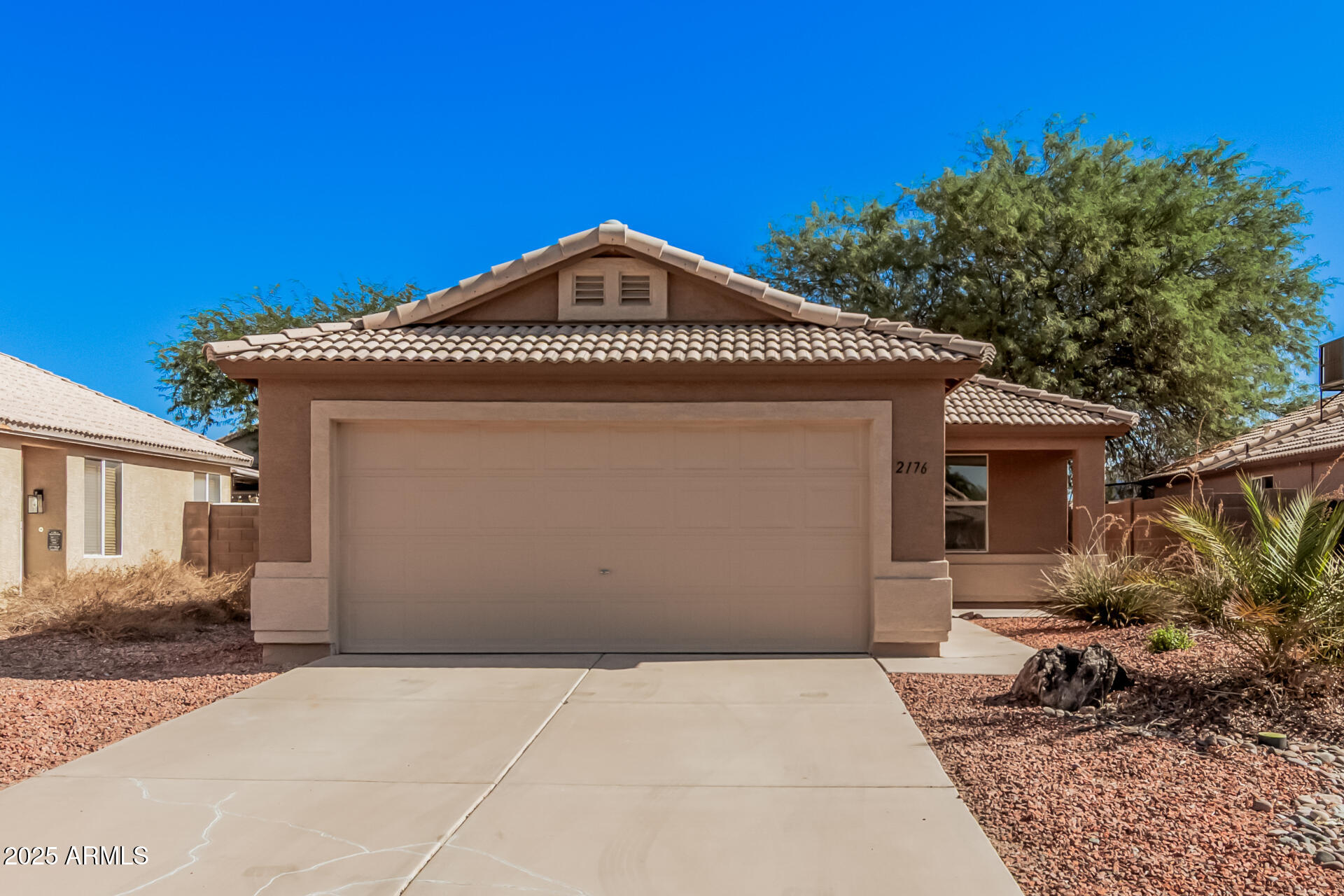2176 West 20th Avenue Apache Junction, AZ 85120 - Photo 1 of 30 a front view of a house with a yard