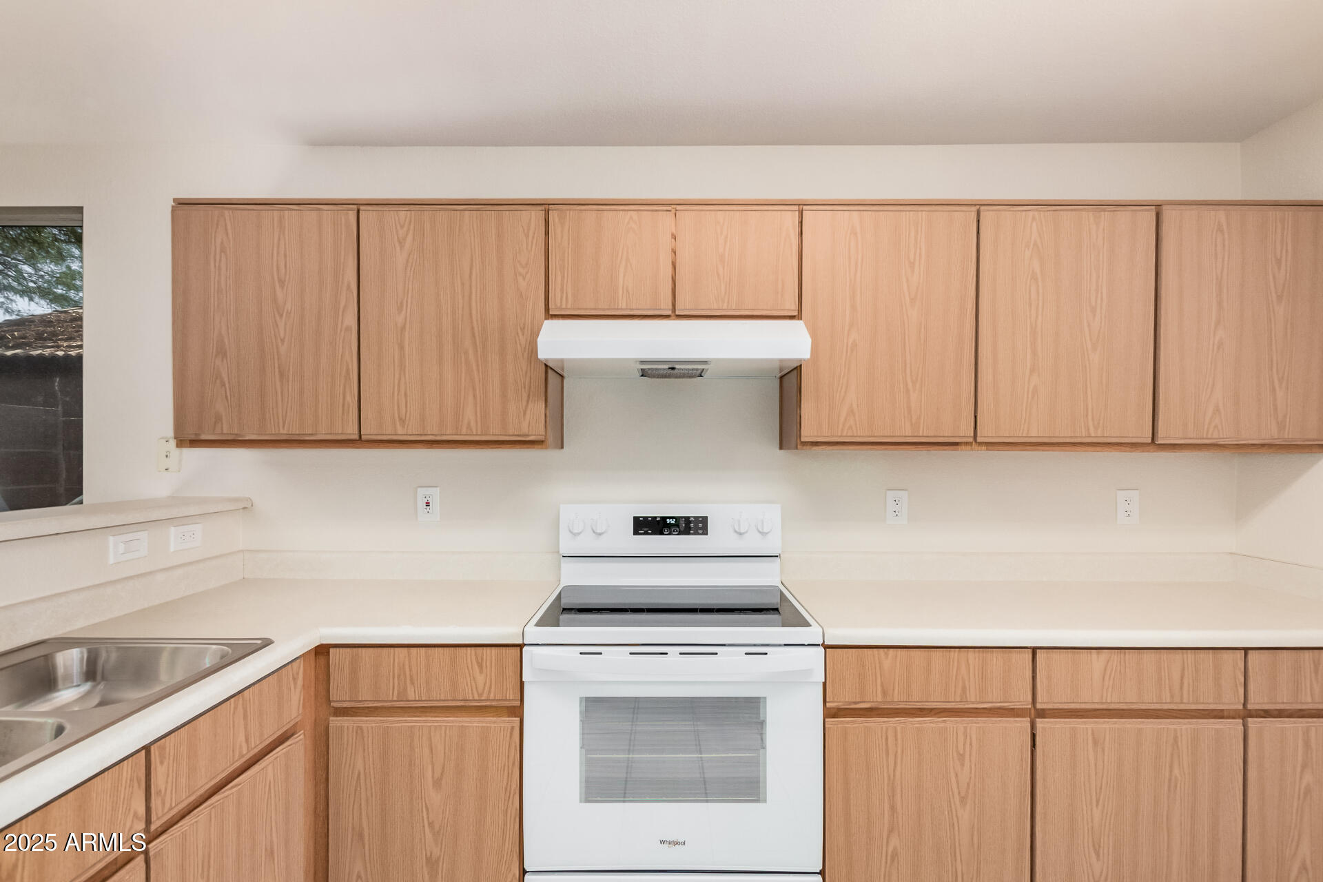 2176 West 20th Avenue Apache Junction, AZ 85120 - Photo 13 of 30 a kitchen with a white cabinets and white appliances