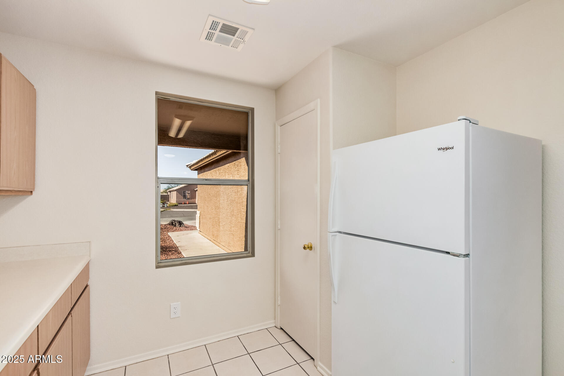 2176 West 20th Avenue Apache Junction, AZ 85120 - Photo 14 of 30 a white refrigerator freezer and a stove sitting inside of a kitchen