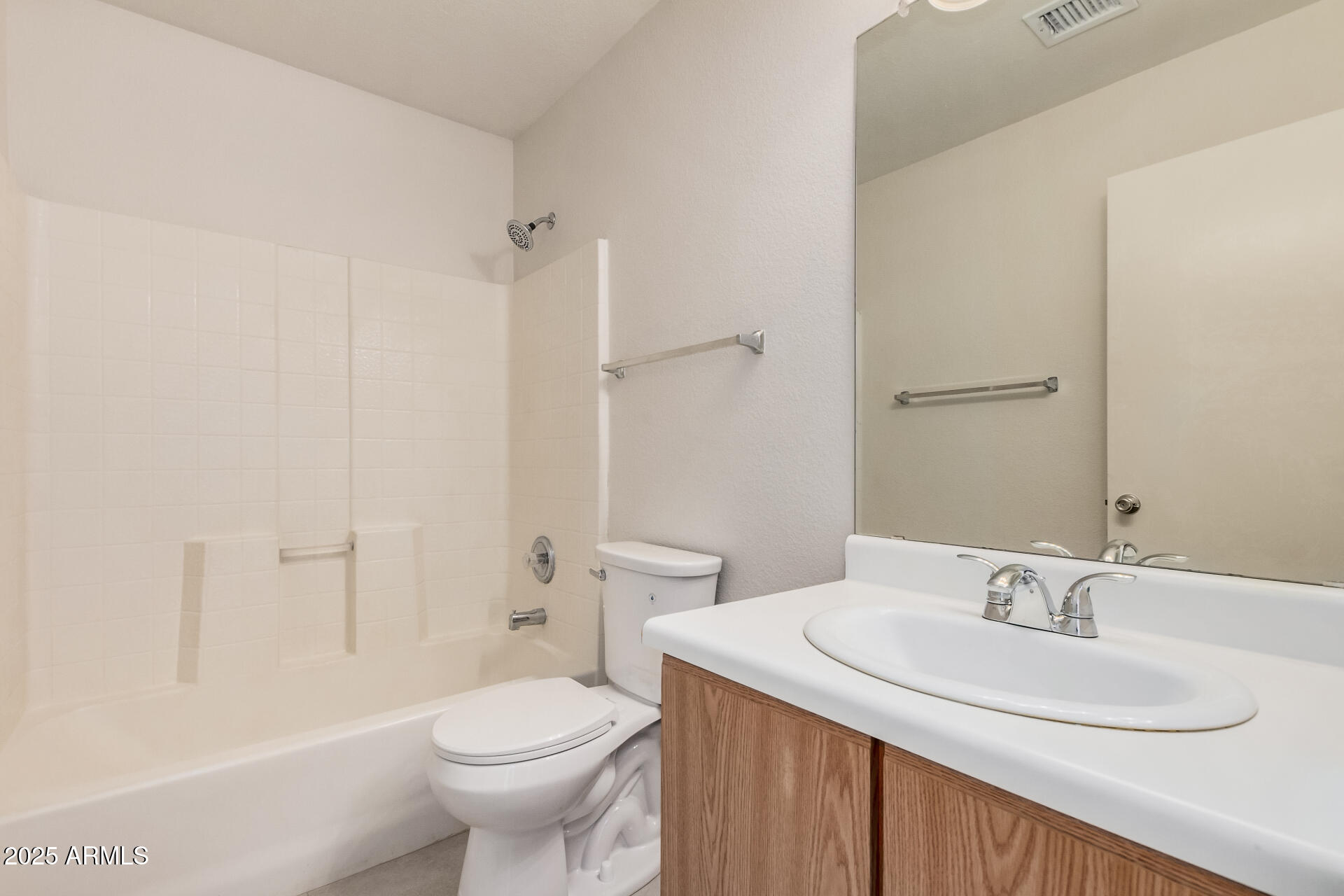 2176 West 20th Avenue Apache Junction, AZ 85120 - Photo 25 of 30 a bathroom with a sink toilet and a mirror