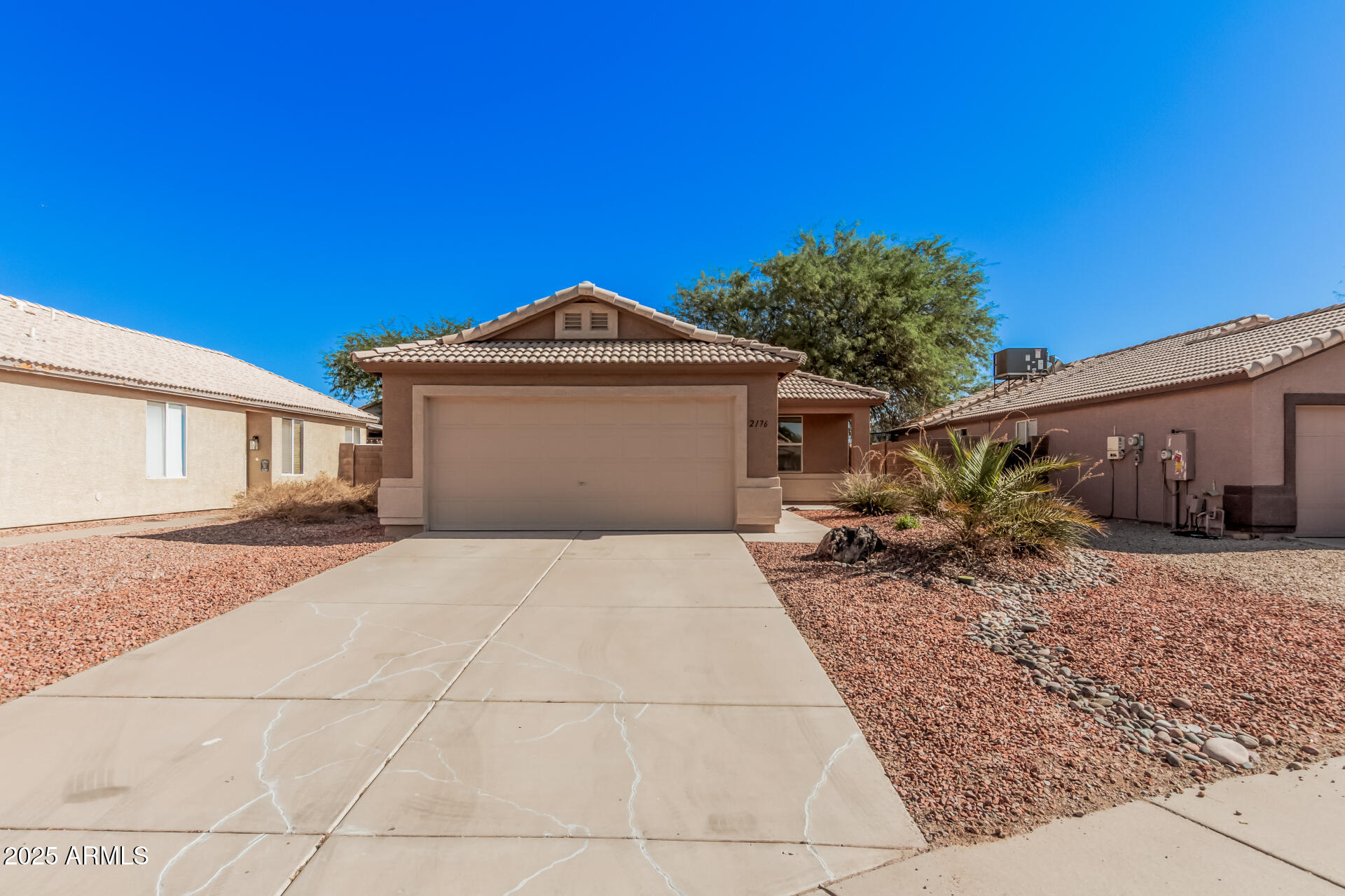 2176 West 20th Avenue Apache Junction, AZ 85120 - Photo 3 of 30 a front view of a house with a yard