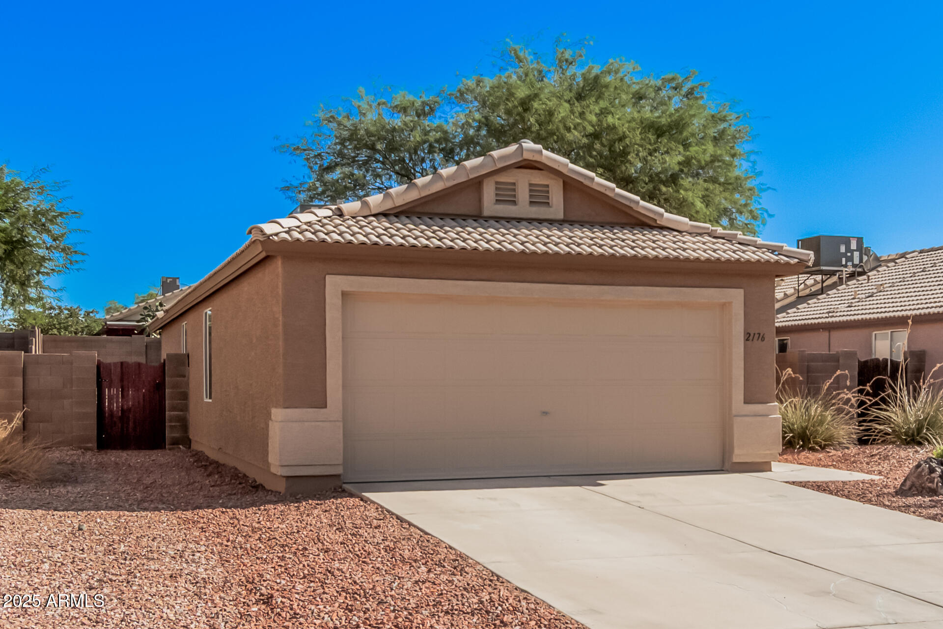 2176 West 20th Avenue Apache Junction, AZ 85120 - Photo 6 of 30 a front view of a house with a yard