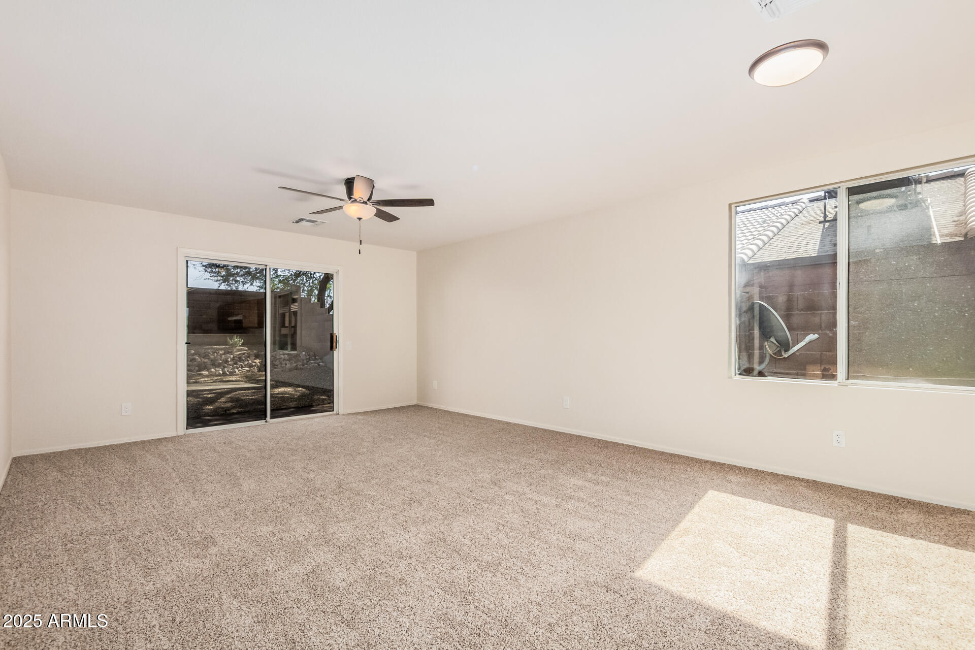 2176 West 20th Avenue Apache Junction, AZ 85120 - Photo 8 of 30 an empty room with windows and cabinet