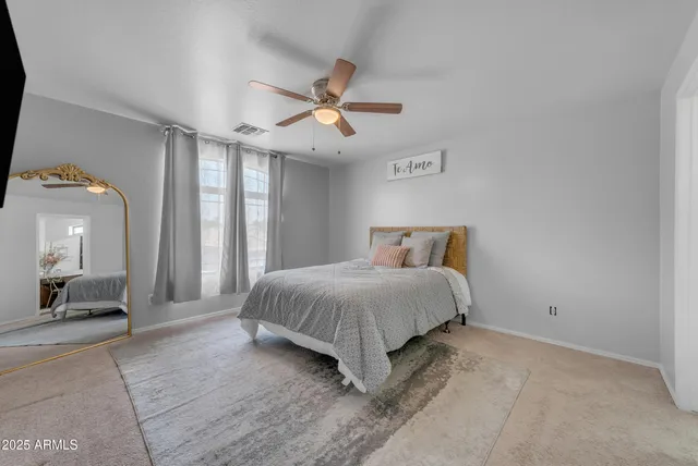 a view of a livingroom with furniture and a flat screen tv