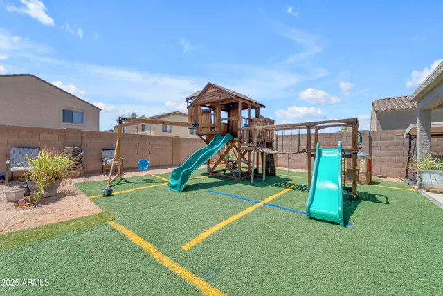 a view of lake with houses in the back
