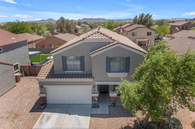 a view of a playground with large trees