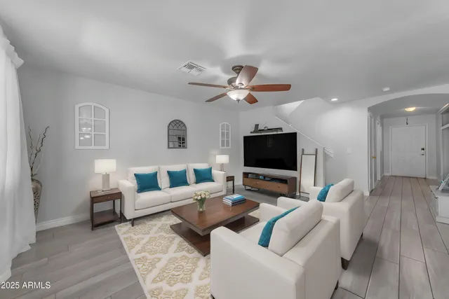 a view of a dining room with furniture and wooden floor