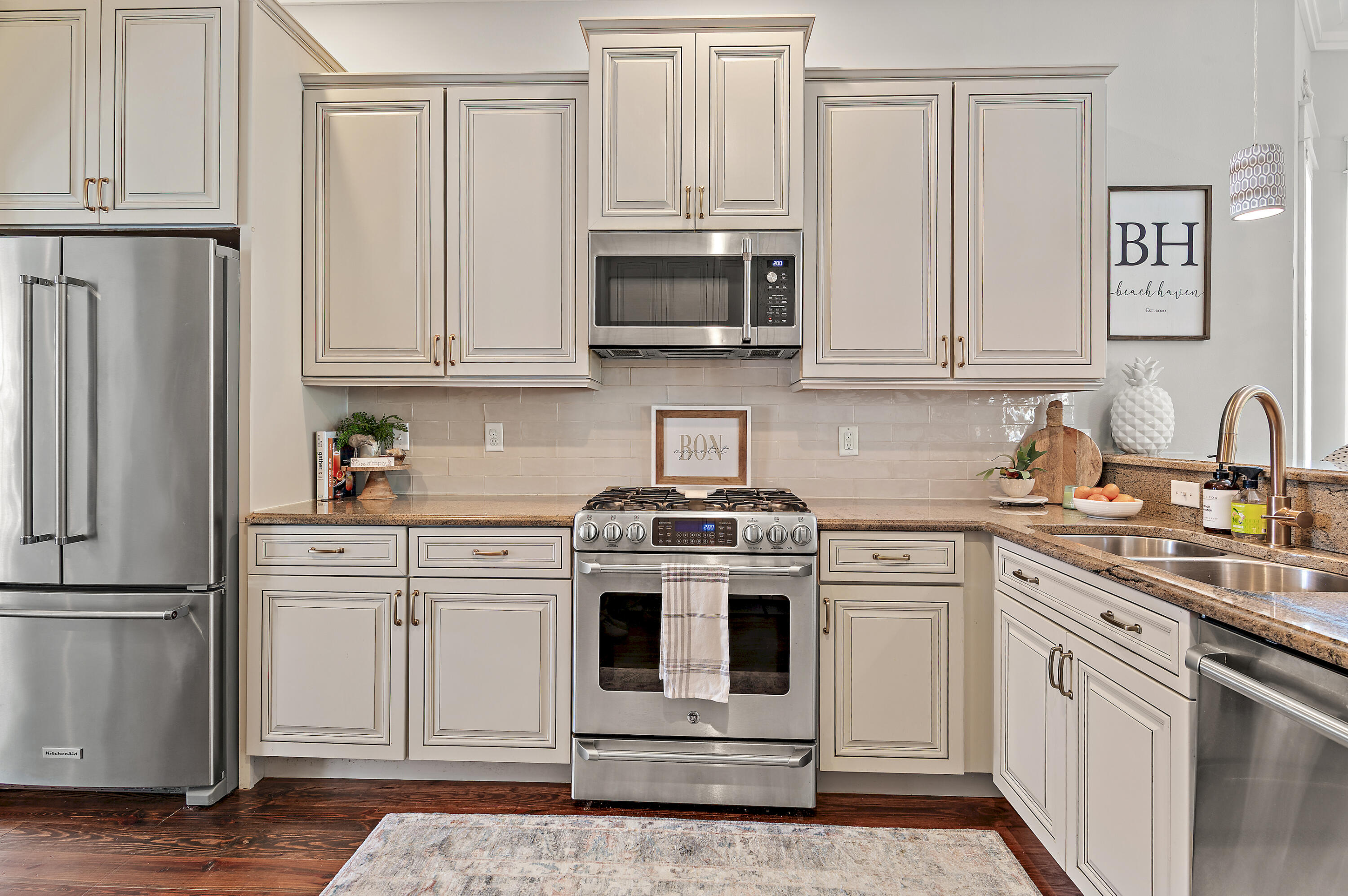 624 Sandgrass Boulevard Santa Rosa Beach, FL 32459 - Photo 15 of 51 a kitchen with white cabinets and white appliances