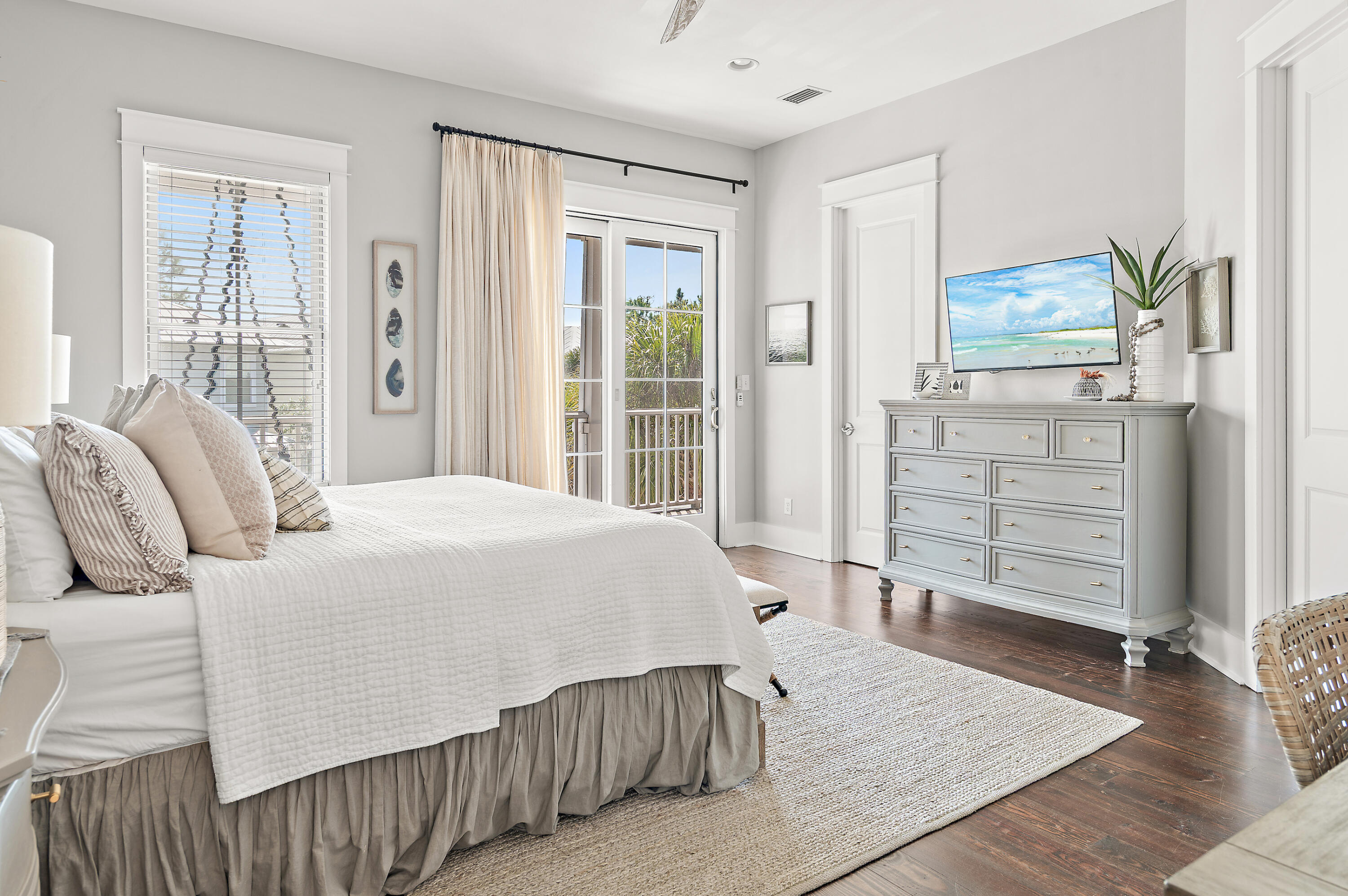 624 Sandgrass Boulevard Santa Rosa Beach, FL 32459 - Photo 26 of 51 a bedroom with a bed and wooden floor