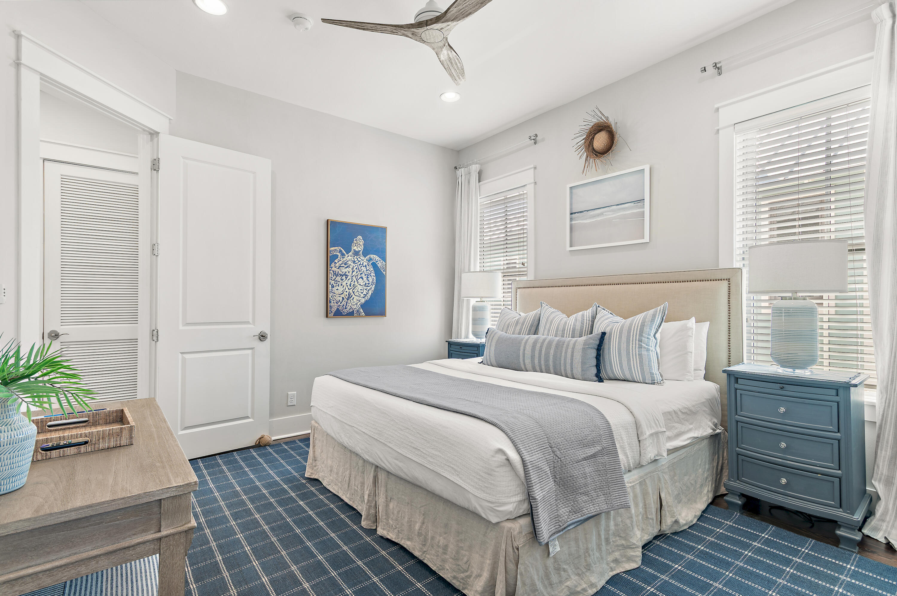 624 Sandgrass Boulevard Santa Rosa Beach, FL 32459 - Photo 30 of 51 a bedroom with a bed and a potted plant