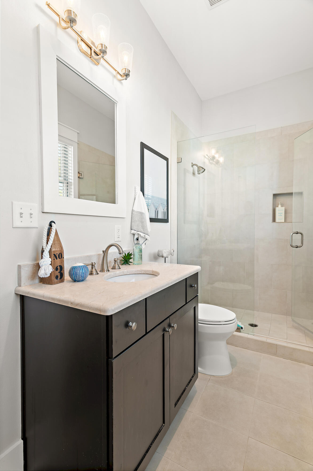 624 Sandgrass Boulevard Santa Rosa Beach, FL 32459 - Photo 31 of 51 a bathroom with a toilet a sink a mirror and shower