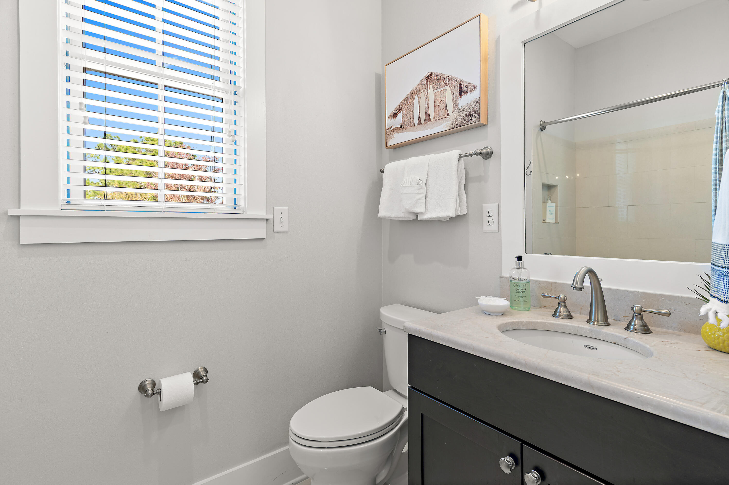 624 Sandgrass Boulevard Santa Rosa Beach, FL 32459 - Photo 33 of 51 a bathroom with a sink a toilet and a window