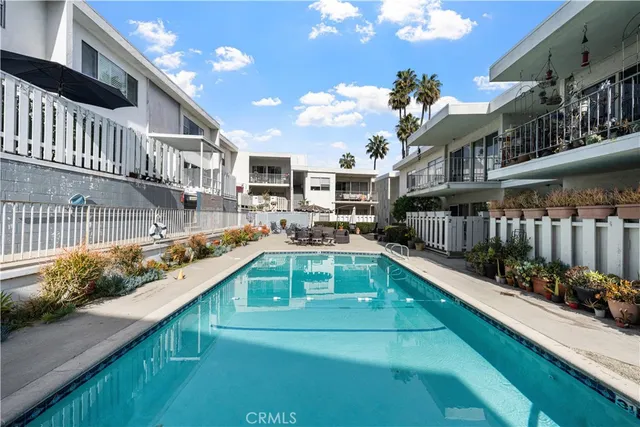 a view of a swimming pool with seating area