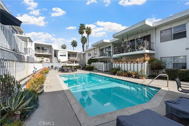 a view of a swimming pool with a patio