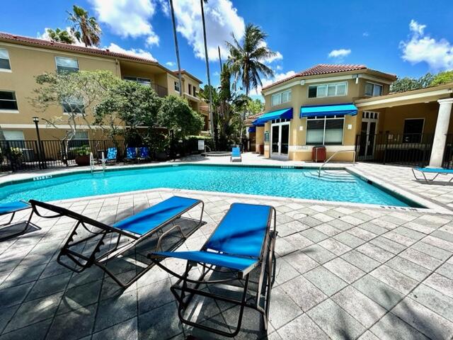 741 North Pine Island Road, Unit 303 Plantation, FL 33324 - Photo 29 of 32 a view of a chairs and table in a yard