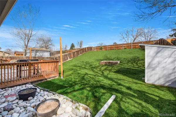 a view of a backyard with sitting area