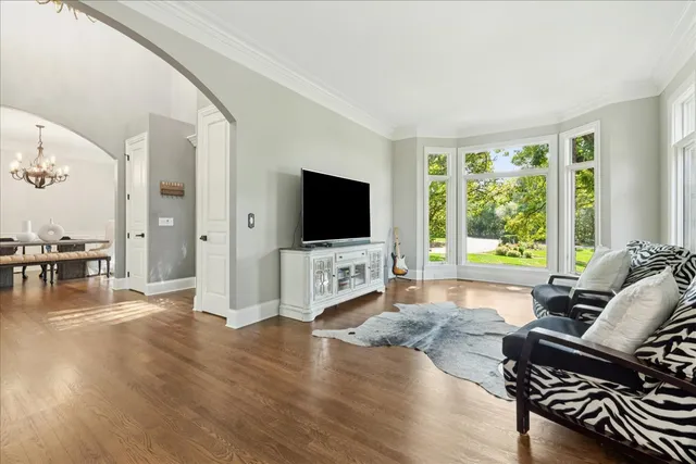 a kitchen with stainless steel appliances granite countertop a stove a sink and a dining table