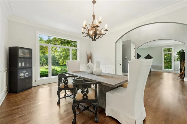 a kitchen with stainless steel appliances granite countertop sink stove and refrigerator