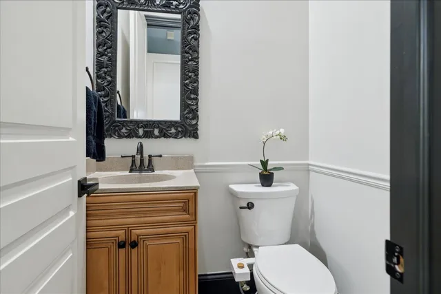 a bed room with a bed and a chair