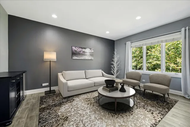 a walk in closet and view of bathroom