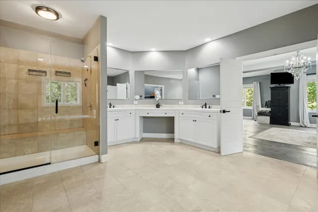 a bathroom with a toilet a sink and shower
