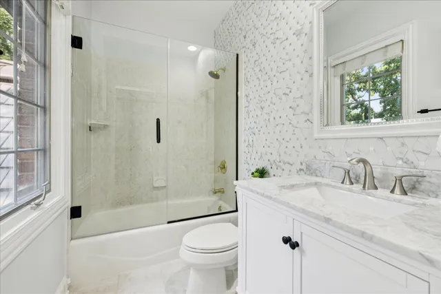 a room with granite countertop lots of wooden furniture