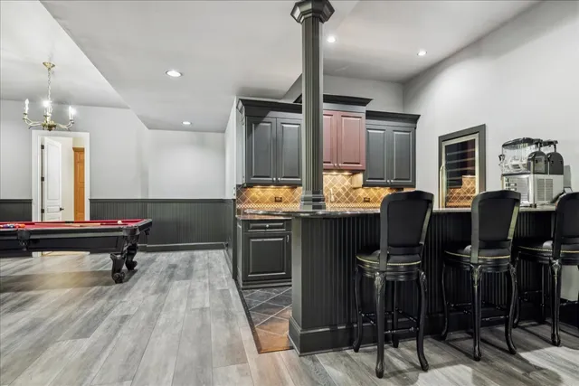 a view of a wooden deck with chairs