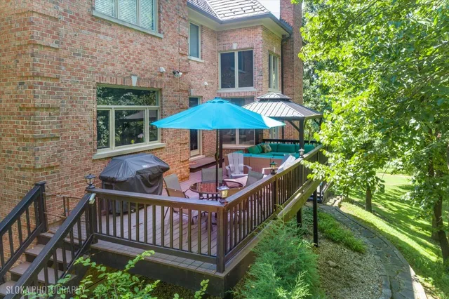 an aerial view of lake houses and trees