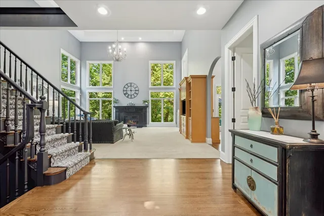 a living room with furniture and a ceiling fan