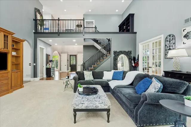 a view of a dining room with furniture wooden floor and chandelier