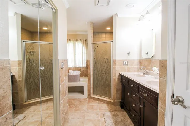 a bathroom with a sink vanity and a mirror