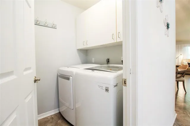 a dining room with a table and a bookshelf