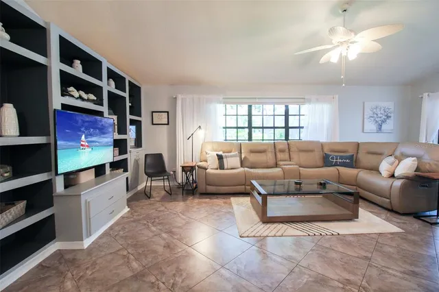 a kitchen with granite countertop a refrigerator oven a sink and dishwasher