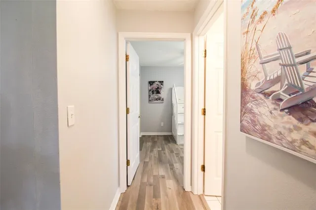 a room with a baby crib and a window