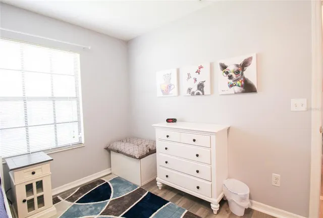 a bathroom with a sink a mirror a toilet and shower