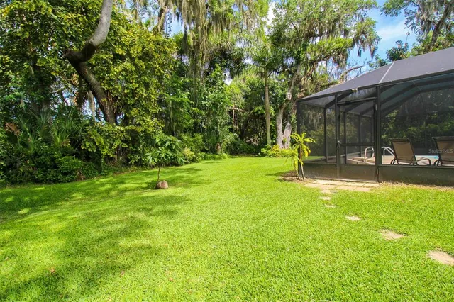 a swimming pool with outdoor seating yard and outdoor seating
