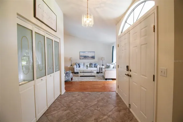 a living room with furniture window and a table